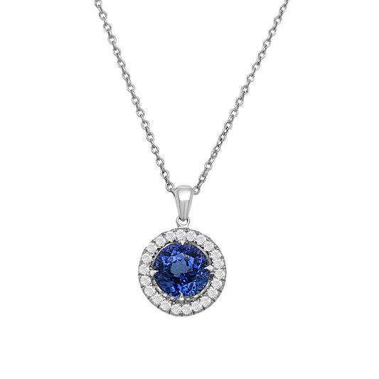 A dazzling Round Tanzanite pendant surrounded by a sparkling Diamond Halo, showcasing elegant craftsmanship and timeless beauty. The vibrant blue Tanzanite steals the spotlight, complemented by the brilliance of the surrounding Diamonds. A luxurious piece that exudes sophistication and captures the essence of refined style. Perfect for adding a touch of glamour to any occasion or as a cherished gift for someone special.