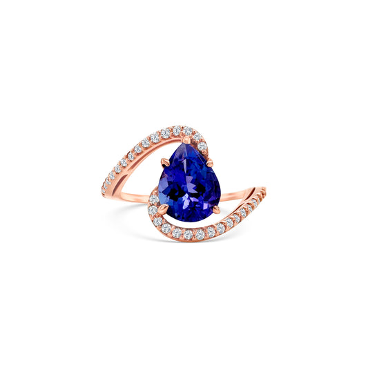 A sparkling, pear-shaped tanzanite, set in gleaming, white gold, surrounded by shimmering, round-cut diamonds, creating a stunning, elegant ring, perfect for any special occasion.