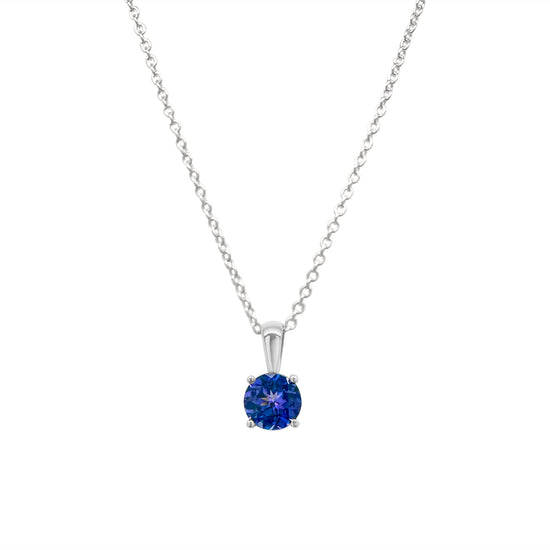 round, solitaire, tanzanite, pendant, shimmering, gemstone, jewelry, accessory, exquisite, craftsmanship, elegant, design, sterling, silver, setting, luxurious, necklace, precious, stone, beautiful, fashion, statement.