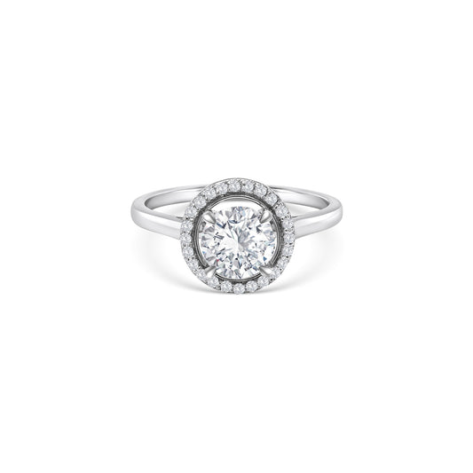  "Brilliant cut diamond ring," "Halo diamond ring," "Engagement ring," "Wedding ring," "Fine jewelry," "Luxury ring," "Diamond jewelry," "Sparkling diamond ring," "Fashion accessory."