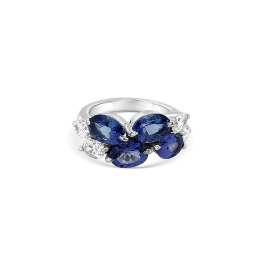 "Oval Tanzanite & Diamond Ring," "Exquisite Tanzanite and Diamond Jewelry," "Luxurious Gemstone Ring," "Elegant Tanzanite Ring," "Sparkling Diamond Accents," "Statement Gemstone Ring," "Beautiful Oval Tanzanite Stone," "Sophisticated Diamond Setting," "Tanzanite and Diamond Combination," "Stunning Oval Gemstone Ring."