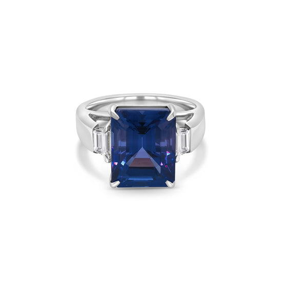 Emerald cut tanzanite ring, Trilogy ring, Diamond accent ring, Elegant gemstone jewelry, Statement piece, Luxury fashion accessory.
