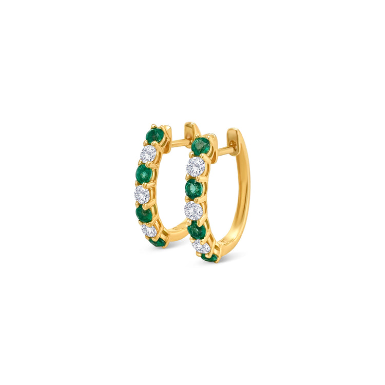 Round emerald and diamond huggy earrings, elegant jewelry, precious gemstones, fine craftsmanship, sparkling diamonds, vibrant emeralds, exquisite design, luxurious accessories.