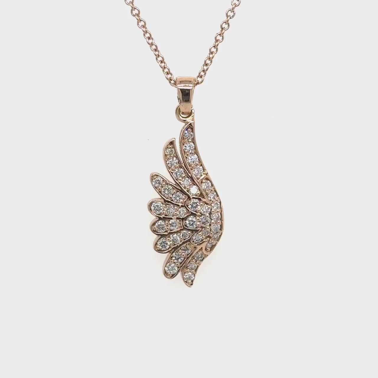  Wing-shaped, diamond pendant, jewelry accessory, elegant design, sparkling gemstones, luxury necklace, fashion statement, exquisite craftsmanship.