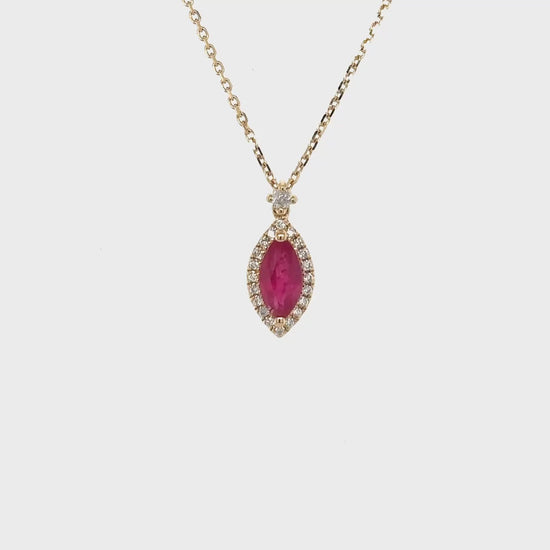 Marquise Ruby & Diamond Halo Pendant: Elegant, timeless, sophisticated, ruby pendant, diamond accents, halo design, fine jewelry, luxurious accessory, statement piece, special occasion wear.