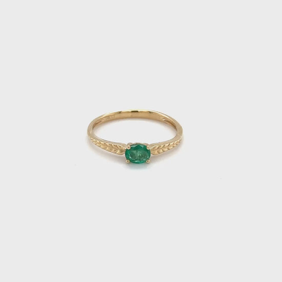 "Oval emerald solitaire ring, sparkling green gemstone, exquisite jewelry piece, elegant emerald ring, statement accessory, precious stone ring, luxurious emerald jewelry, timeless fashion item, fine gemstone ring, sophisticated oval ring."