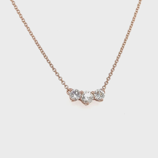 A dazzling three-stone diamond pendant, elegant diamond necklace, exquisite triple-stone pendant.