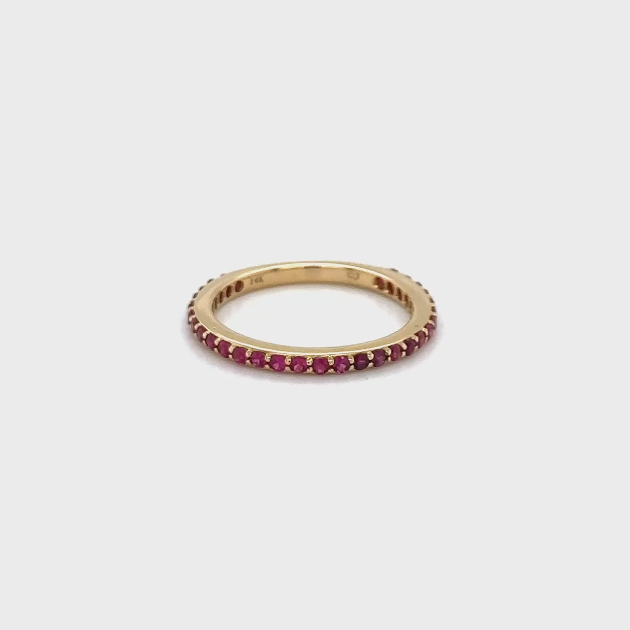 "Round Ruby Eternity Ring," "Ruby Eternity Band," "Red Gemstone Ring," "Eternity Ring with Rubies," "Round Cut Ruby Ring," "Elegant Ruby Jewelry," "Luxury Ruby Ring," "Gemstone Eternity Ring," "Fine Ruby Accessories," "Statement Ruby Ring," "High-Quality Ruby Jewelry.