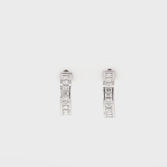  Baguette diamond channel set earrings, elegant jewelry, luxurious accessories, statement earrings, diamond-studded fashion, exquisite craftsmanship, fine jewelry, glamorous ear adornments, sparkling baguette diamonds, refined style, sophisticated elegance, timeless beauty.