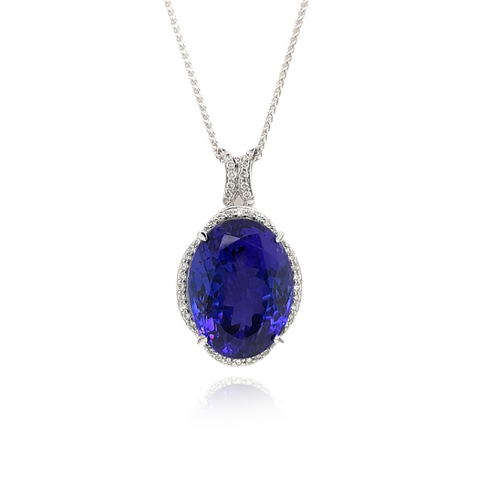  Sure, here are some tags for the Oval Halo Tanzanite Pendant: Tanzanite Jewelry, Oval Pendant, Halo Design, Gemstone Necklace, Elegant Jewelry, Sterling Silver, Precious Stones, Fashion Accessories, Statement Piece, Gift for Her.