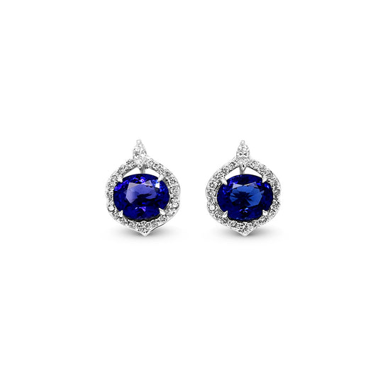  Oval Tanzanite and Diamond Halo Stud Earrings: Elegant Tanzanite studs, dazzling diamond halo, exquisite jewelry, precious gemstone earrings, sparkling gemstone studs, luxurious oval-shaped Tanzanite, radiant diamond accents, stunning halo design, sophisticated stud earrings, timeless and stylish jewelry.