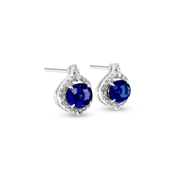  Oval Tanzanite and Diamond Halo Stud Earrings: Elegant Tanzanite studs, dazzling diamond halo, exquisite jewelry, precious gemstone earrings, sparkling gemstone studs, luxurious oval-shaped Tanzanite, radiant diamond accents, stunning halo design, sophisticated stud earrings, timeless and stylish jewelry.