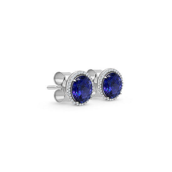 Oval tanzanite earrings Halo diamond stud earrings 10.80ct tanzanite earrings Luxury gemstone earrings Blue-violet tanzanite jewelry Exquisite diamond earrings Statement earrings for special occasions Fine jewelry with tanzanite Precious gemstone earrings Elegant and timeless earrings.