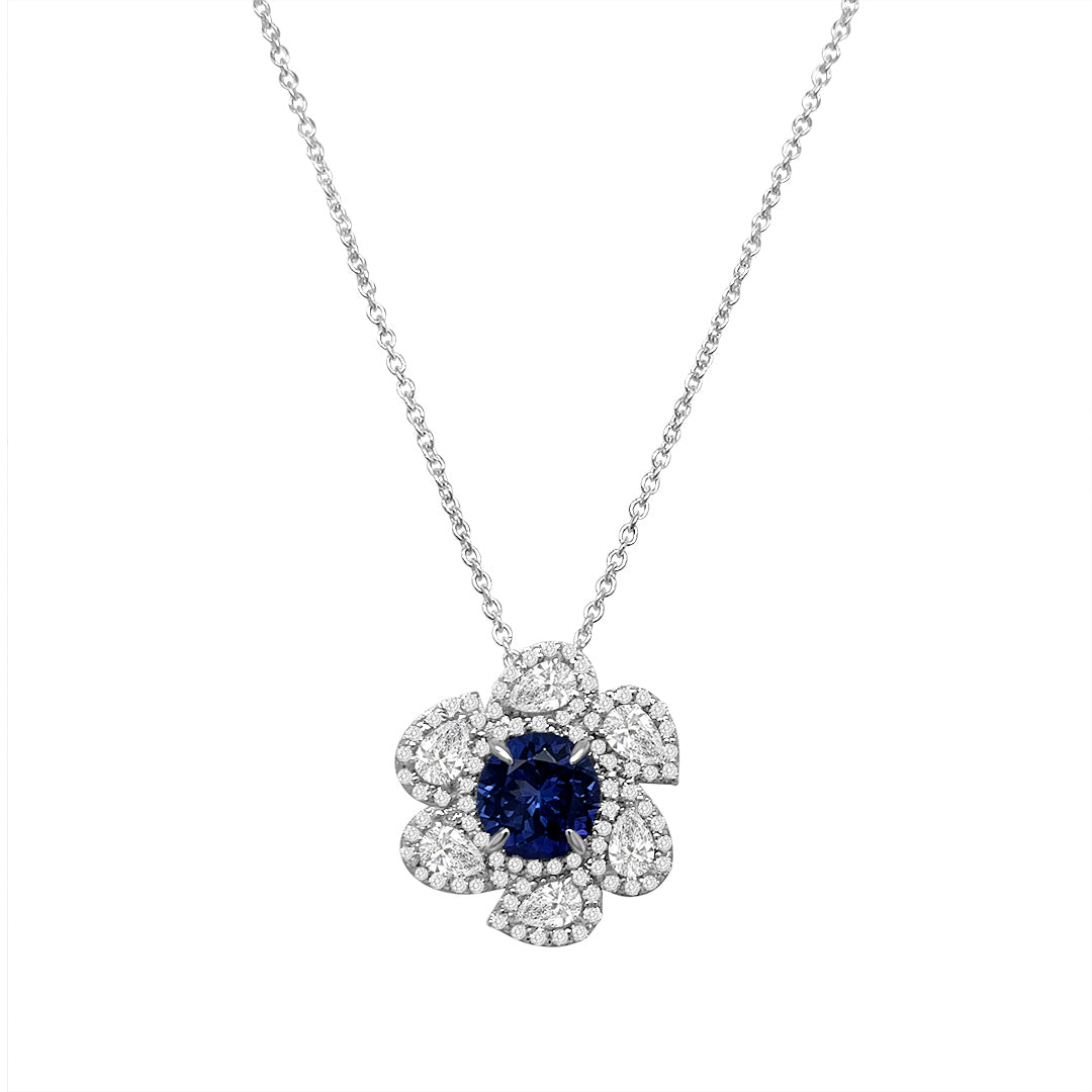 Main Image: "1.70ct Round Tanzanite & Multi-Shape Floral Diamond Pendant" Tanzanite Close-up: "Deep Blue Round Tanzanite Gemstone" Floral Diamond Surround: "Intricate Multi-Shape Diamond Floral Design" Pendant Chain: "Shimmering Chain for Tanzanite and Diamond Pendant" Elegant Neckwear: "Luxurious Tanzanite and Diamond Necklace" Nature-Inspired Elegance: "Floral Diamond Pendant with Round Tanzanite"