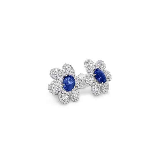 Main Image: "1.60ct Oval Tanzanite & Multi-Shape Floral Diamond Stud Earrings" Tanzanite Detail: "Vivid Oval Tanzanite Gemstone" Floral Diamond Arrangement: "Intricate Floral Diamond Design" Earring Profile: "Multi-Shape Floral Stud Earring Profile" Custom Open Liners: "Earrings with Different Open Liner Options" Timeless Elegance: "Diamond Stud Earrings with Tanzanite and Floral Design"