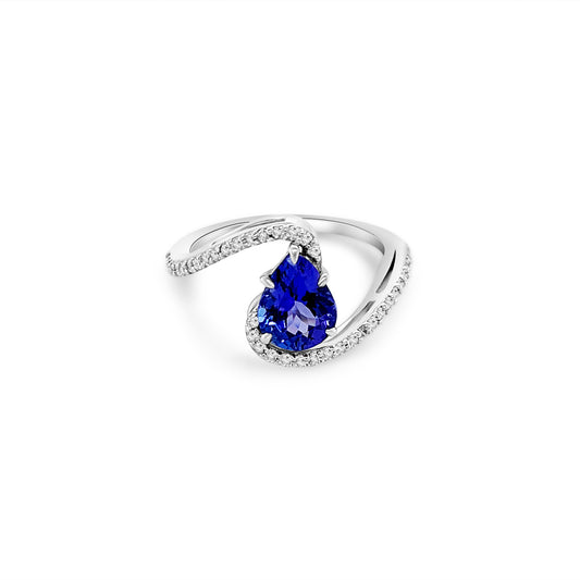 Main Image: "1.50ct Pear Shape Tanzanite & Diamond Ring" Side View: "Pear Shaped Tanzanite Gemstone Ring" Diamond Detail: "Diamond Halo Accent on Tanzanite Gemstone Ring" Elegance in Design: "Elegant Design with Pear Shaped Tanzanite" Customization Options: "Different Open Liners for Personalization" Versatile Elegance: "Versatile Gemstone Ring for Various Occasions"