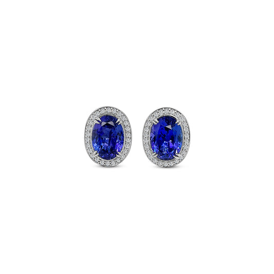 Main Image: "7.70ct Oval Tanzanite & Diamond Halo Stud Earrings" Tanzanite Detail: "Captivating Oval Tanzanite Gems" Diamond Halo: "Sparkling Diamond Halo Accentuating Tanzanite" Earring Profile: "Oval Tanzanite & Diamond Halo Stud Earrings Profile" Customizable Liners: "Earrings with Different Open Liners for Personalization" Stylish Presentation: "Elegant Presentation of Oval Tanzanite & Diamond Earrings"