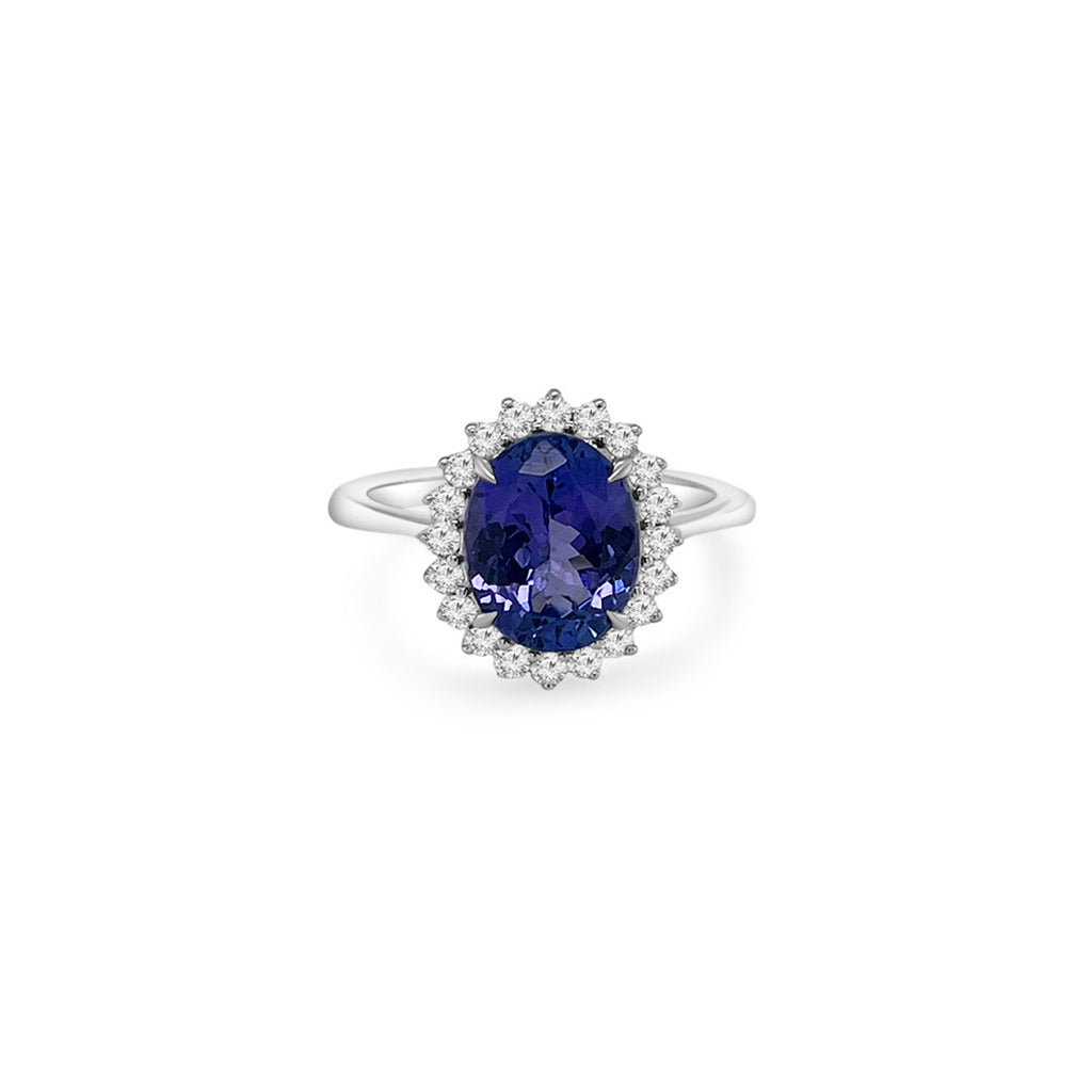 Main Image: "2.90ct Oval Tanzanite & Floral Diamond Halo Ring" Tanzanite Detail: "Oval-Cut Tanzanite Gemstone" Floral Halo: "Intricate Floral Diamond Halo" Ring Profile: "Profile View of Tanzanite & Diamond Ring" Custom Liners: "Ring with Different Open Liner Options" Timeless Beauty: "Elegant Oval Tanzanite Ring with Floral Halo"