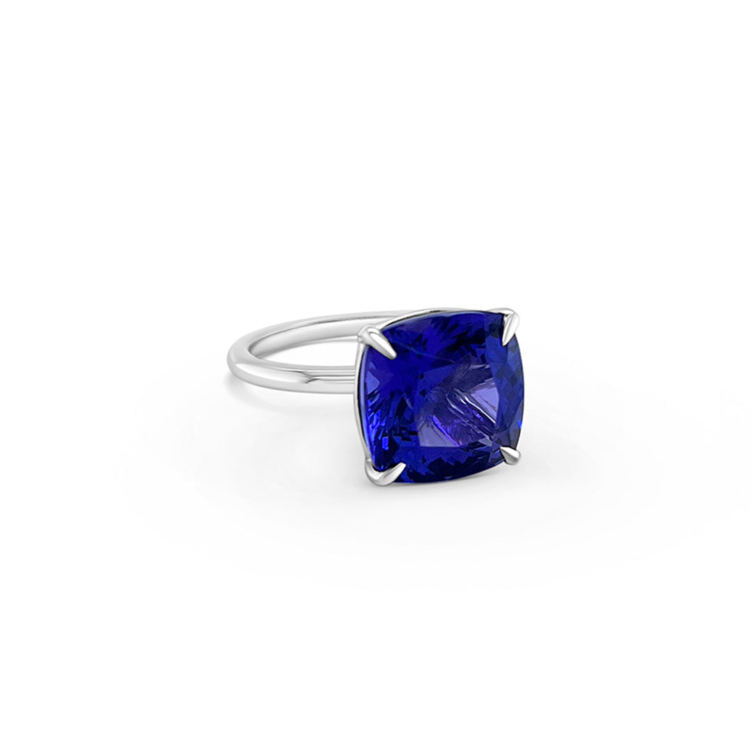 Main Image: "8.40ct Solitaire Cushion Tanzanite & Diamond Ring" Tanzanite Detail: "Vivid Cushion-Cut Tanzanite Gemstone" Diamond Halo: "Diamond Halo Accentuating Tanzanite Ring" Ring Profile: "Solitaire Tanzanite & Diamond Ring with Custom Open Liners" Elegant Craftsmanship: "Luxury Cushion Tanzanite Ring by BYL Diamonds"