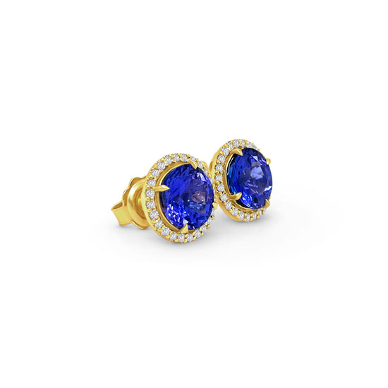 Elevate your style with our 4.10ct Tanzanite & Diamond Halo Stud Earrings, a true masterpiece in jewelry design. Experience the allure of tanzanite and the sparkle of diamonds with our exquisite 4.10ct Tanzanite & Diamond Halo Stud Earrings. Make a statement of elegance with these 4.10ct Tanzanite & Diamond Halo Stud Earrings, a perfect blend of luxury and sophistication.