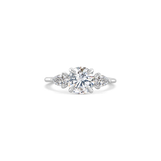 A stunning Round Brilliant Trilogy Diamond Ring, featuring sparkling diamonds in a breathtaking Pear Shape design, symbolizing everlasting love and elegance."