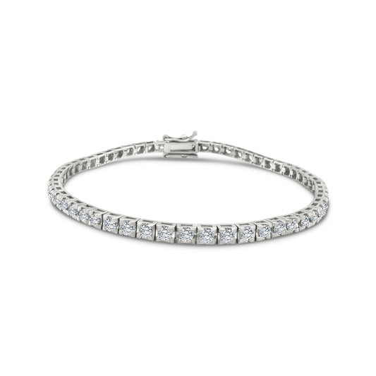 A stunning diamond tennis bracelet, featuring brilliant-cut diamonds set in a sleek, white gold setting. Perfect for adding elegance and sophistication to any outfit, this timeless piece exudes luxury and glamour. A dazzling accessory that sparkles with every movement, making it a must-have for any jewelry collection. 