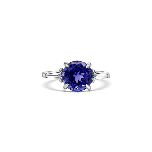 "Round Cut Tanzanite & Diamond Ring," "Exquisite Round Cut Tanzanite Ring," "Luxurious Diamond Jewelry with Round Cut Tanzanite," "Elegant Round Cut Gemstone Ring," "Fine Jewelry featuring Round Cut Tanzanite and Diamonds," "High-Quality Round Cut Tanzanite Ring," "Statement Round Cut Gemstone and Diamond Ring," "Sparkling Tanzanite and Diamond Jewelry with Round Cut," "Beautiful Round Cut Gemstone Ring," "Fashionable Tanzanite & Diamond Ring with Round Cut."