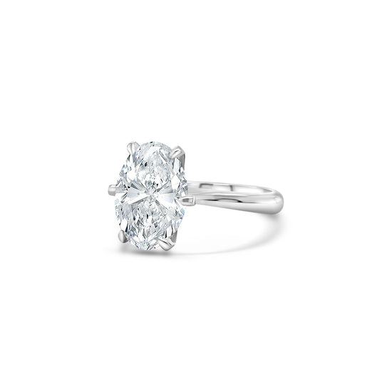 A, shimmering, oval, solitaire, diamond, ring, glitters, gracefully, on, a, finger, adorned, with, elegance, and, sophistication, perfect, for, engagements, or, special, occasions