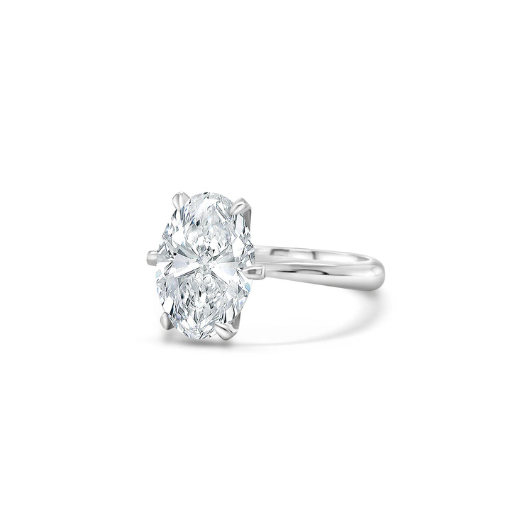 A, shimmering, oval, solitaire, diamond, ring, glitters, gracefully, on, a, finger, adorned, with, elegance, and, sophistication, perfect, for, engagements, or, special, occasions