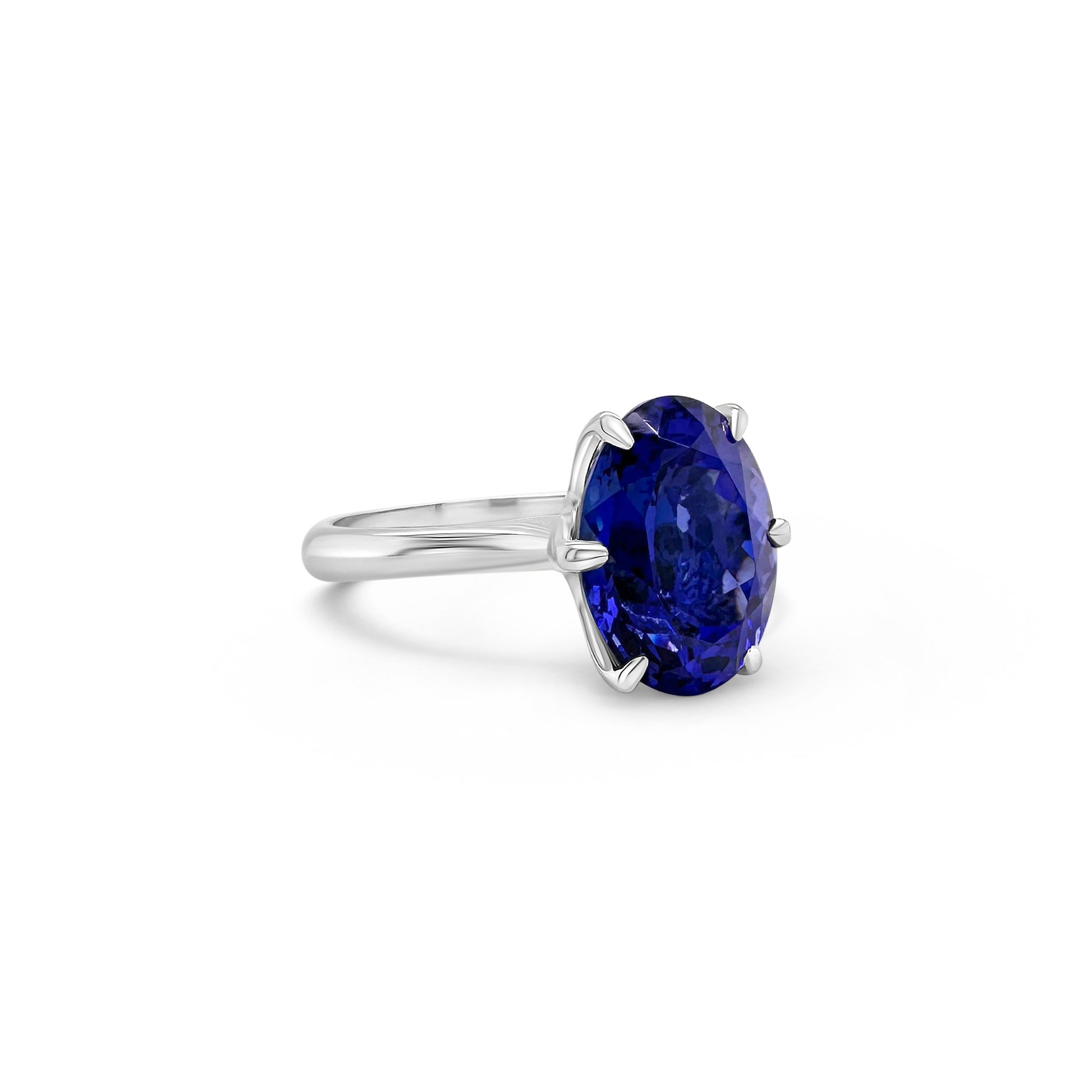 A, luxurious, oval-shaped, tanzanite, gemstone, ring, featuring, a, single, stone, set, in, a, classic, solitaire, setting, with, a, sparkling, band.