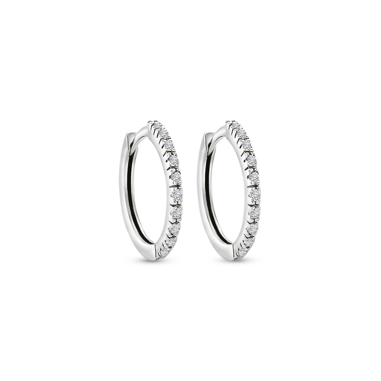 "Round Brilliant Diamond Earrings," "Huggy Earrings," "Diamond Stud Earrings," "Small Diamond Hoops," "Classic Diamond Jewelry," "Everyday Diamond Earrings," "Diamond Huggie Hoops," "Timeless Diamond Accessories."