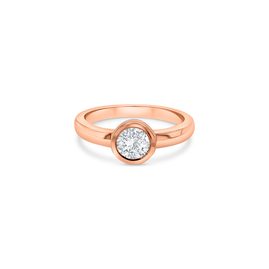 "A round brilliant solitaire diamond ring, sparkling diamond ring, elegant engagement ring, classic diamond solitaire, timeless diamond jewelry, shimmering diamond band, luxurious single stone ring, stunning round cut diamond, exquisite diamond engagement ring."