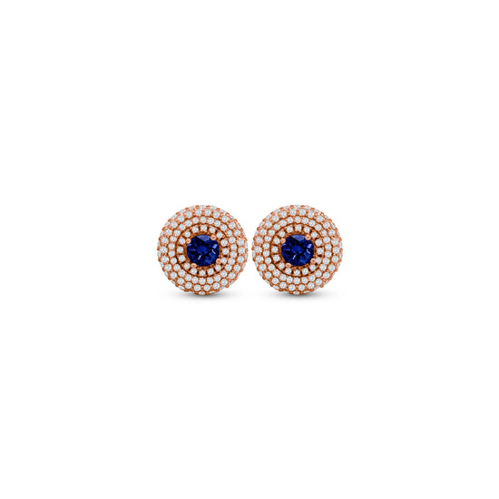 Exquisite Round Tanzanite Triple Halo Diamond Studs, elegant gemstone earrings, luxurious Tanzanite studs, sparkling diamond accents, triple halo design, statement jewelry, fine gemstone studs, sophisticated earrings, radiant Tanzanite stones, dazzling diamond brilliance.