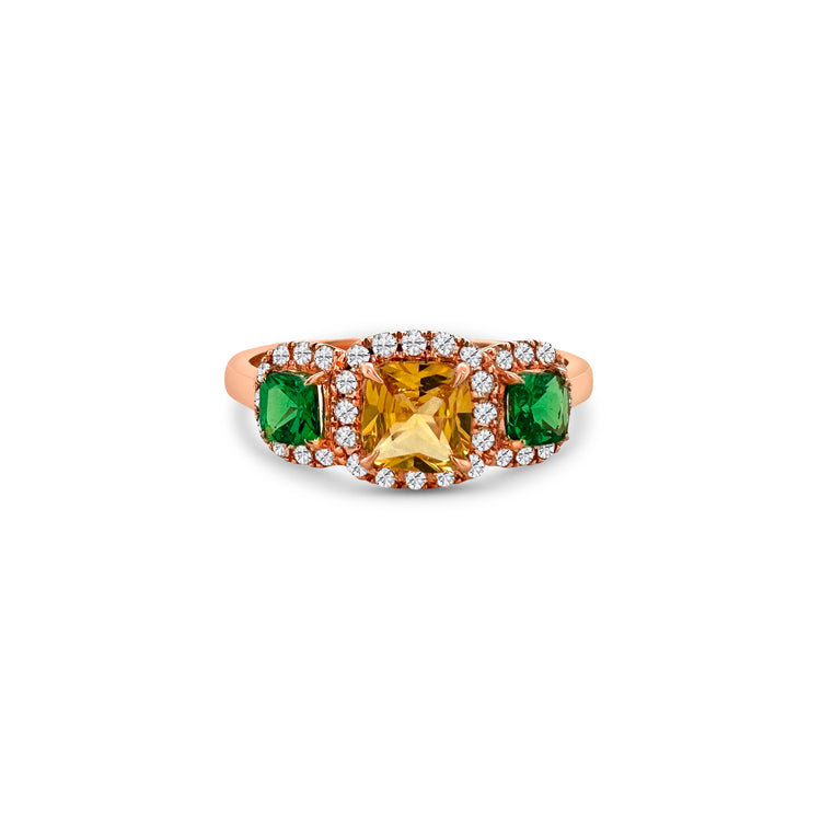 A stunning Trilogy Halo Ring featuring, a vibrant Sapphire, a dazzling Tsavorite, and brilliant Diamonds, set in luxurious gold, showcasing timeless elegance and exquisite craftsmanship.