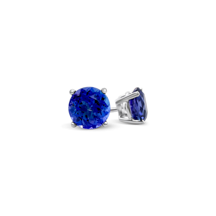 Round Tanzanite stud earrings, sparkling Tanzanite studs, elegant Tanzanite ear studs, precious Tanzanite gems, classic round Tanzanite earrings, beautiful blue Tanzanite studs, stunning Tanzanite jewelry, dainty Tanzanite studs, exquisite round Tanzanite earrings, vibrant Tanzanite studs.