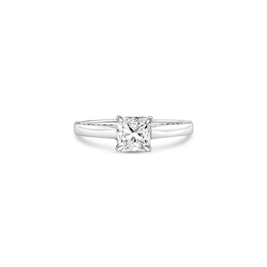 "A stunning cushion-cut diamond ring," "a luxurious solitaire engagement ring," "a sparkling diamond ring for special occasions," "an elegant cushion-cut solitaire ring," "a timeless diamond ring design," "a classic cushion-cut diamond engagement ring."