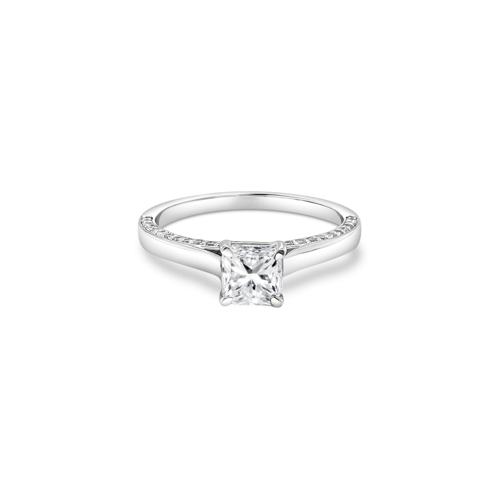 "A stunning cushion-cut diamond ring," "a luxurious solitaire engagement ring," "a sparkling diamond ring for special occasions," "an elegant cushion-cut solitaire ring," "a timeless diamond ring design," "a classic cushion-cut diamond engagement ring."