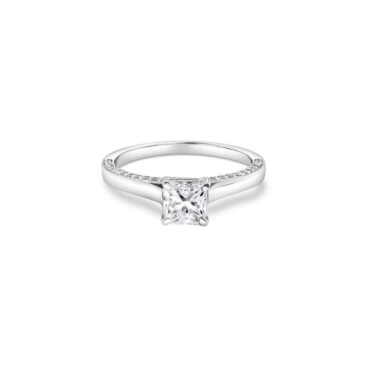 "A stunning cushion-cut diamond ring," "a luxurious solitaire engagement ring," "a sparkling diamond ring for special occasions," "an elegant cushion-cut solitaire ring," "a timeless diamond ring design," "a classic cushion-cut diamond engagement ring."