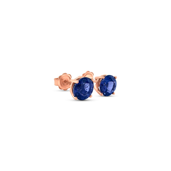 "Round Tanzanite Stud Earrings," "Tanzanite Studs," "Tanzanite Jewelry," "Gemstone Earrings," "Elegant Tanzanite Studs," "Classic Tanzanite Jewelry," "Round Gemstone Earrings," "Tanzanite Accessories," "Stylish Stud Earrings," "Blue Gemstone Studs."