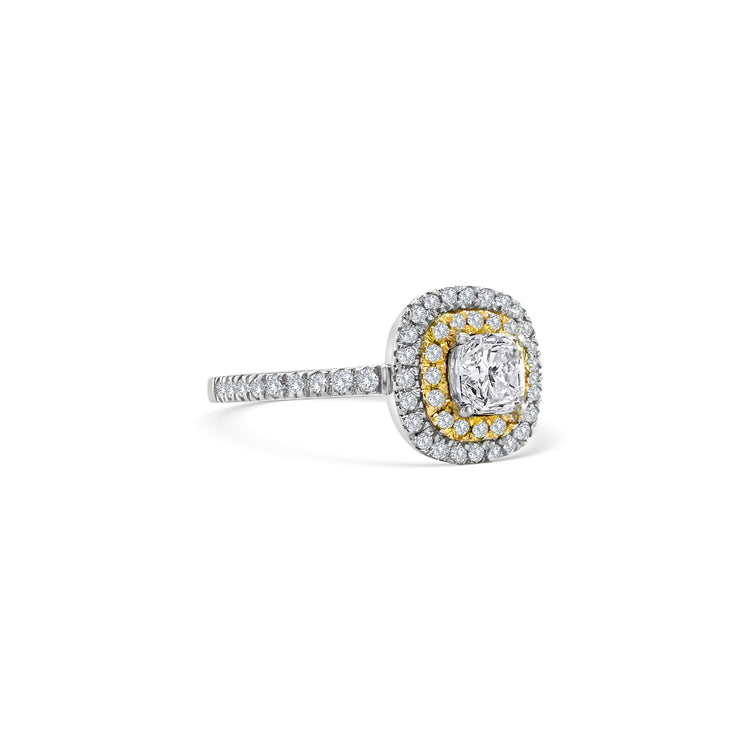 A stunning cushion-cut diamond ring, featuring a double halo design, crafted to perfection, ideal for special occasions, showcasing timeless elegance, with brilliant sparkle, making a statement, symbolizing everlasting love.