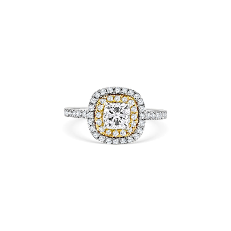 A stunning cushion-cut diamond ring, featuring a double halo design, crafted to perfection, ideal for special occasions, showcasing timeless elegance, with brilliant sparkle, making a statement, symbolizing everlasting love.