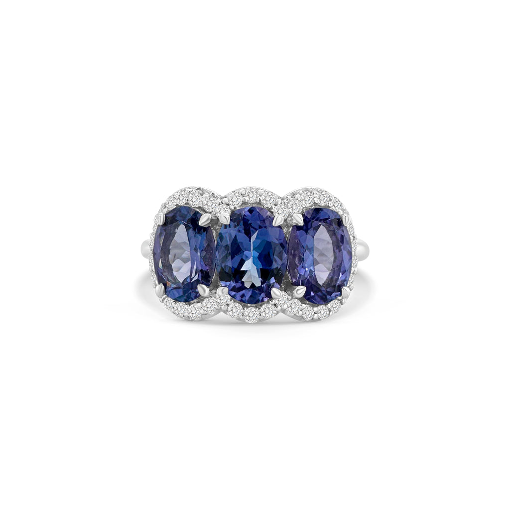 "Oval Cut Tanzanite Diamond Halo Ring," "Tanzanite Halo Ring," "Diamond Halo Ring," "Fine Jewelry," "Luxury Ring," "Fashion Ring," "Tanzanite Jewelry," "Sparkling Halo Ring," "Statement Ring," "Elegant Jewelry," "Special Occasion Ring," "Tanzanite and Diamond Ring," "Timeless Jewelry," "Handcrafted Tanzanite Ring," "Gemstone Halo Ring."