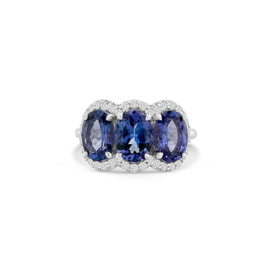 "Oval Cut Tanzanite Diamond Halo Ring," "Tanzanite Halo Ring," "Diamond Halo Ring," "Fine Jewelry," "Luxury Ring," "Fashion Ring," "Tanzanite Jewelry," "Sparkling Halo Ring," "Statement Ring," "Elegant Jewelry," "Special Occasion Ring," "Tanzanite and Diamond Ring," "Timeless Jewelry," "Handcrafted Tanzanite Ring," "Gemstone Halo Ring."