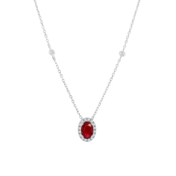 Oval ruby pendant, Diamond halo necklace, Gemstone jewelry, Elegant accessory, Statement piece, Fine jewelry gift, Sparkling gem pendant, Luxury jewelry, Red gemstone necklace, Precious stone pendant.