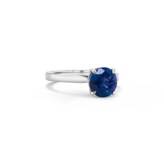 Round Tanzanite Solitaire Ring, Elegant Tanzanite Engagement Band, Stunning Gemstone Ring, Classic Tanzanite Solitaire, Timeless Tanzanite Jewelry, Dazzling Tanzanite Statement Piece