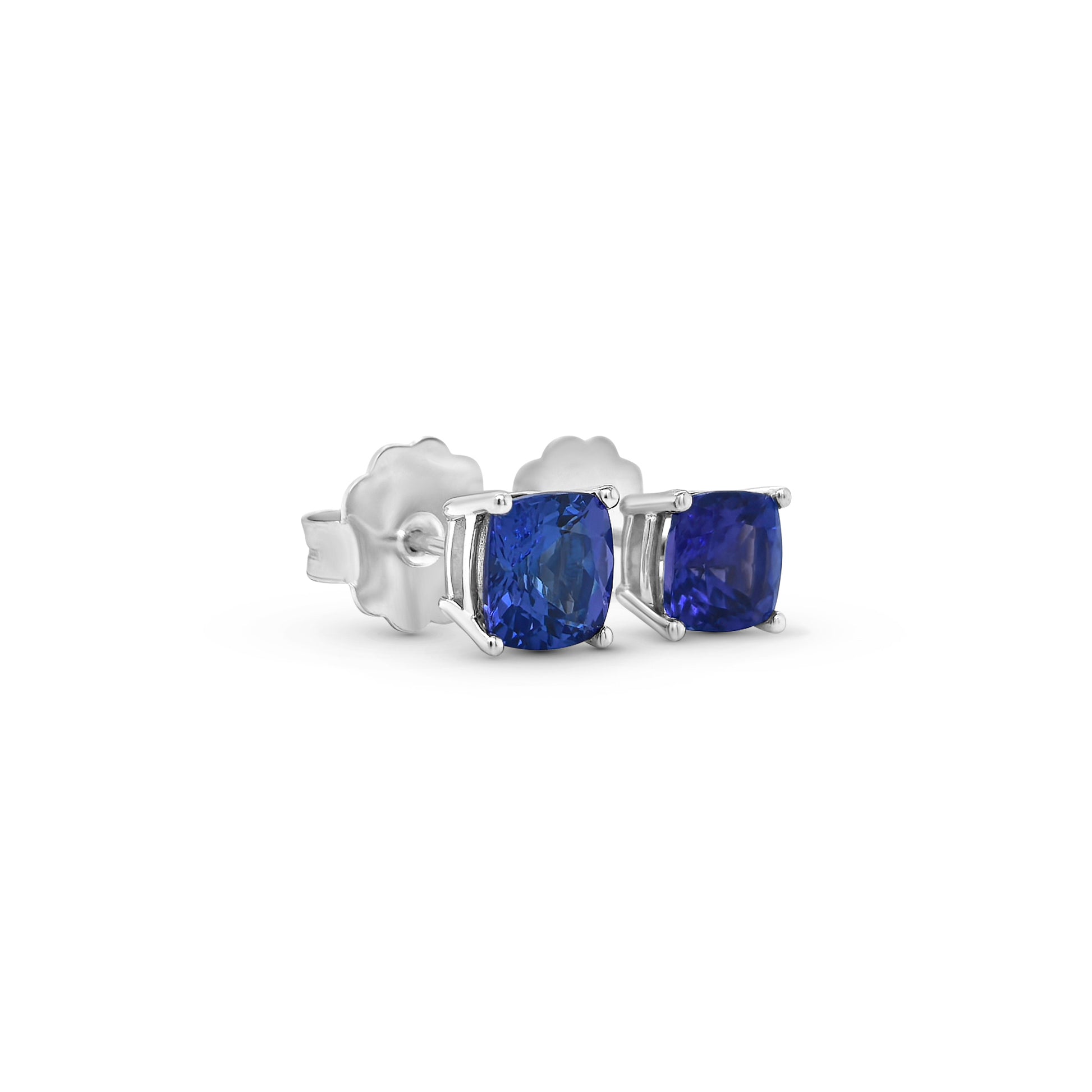 "Cushion Cut Tanzanite Stud Earrings," "Tanzanite Stud Earrings," "Fine Jewelry," "Luxury Earrings," "Fashion Earrings," "Gemstone Jewelry," "Sparkling Tanzanite Earrings," "Statement Earrings," "Elegant Jewelry," "Special Occasion Earrings," "Cushion Cut Earrings," "Tanzanite Jewelry," "Timeless Jewelry," "Handcrafted Earrings," "Unique Gemstone Studs."