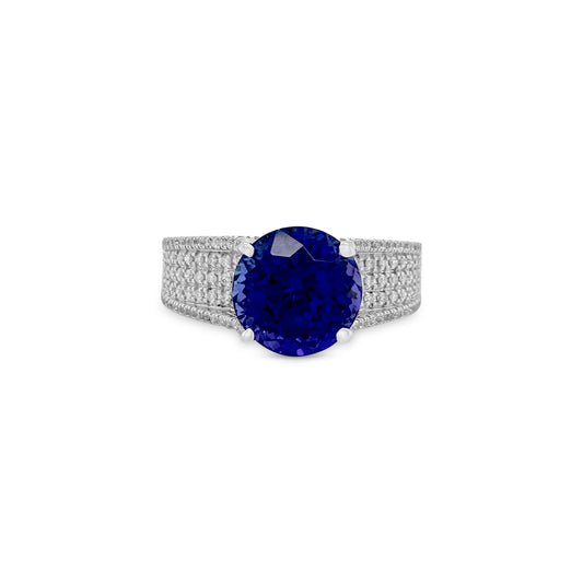 "Round Tanzanite & Diamond Ring," "Exquisite Round Cut Tanzanite Engagement Ring," "Luxurious Round Tanzanite with Diamonds Ring," "Elegant Round Tanzanite Diamond Cocktail Ring," "Fine Jewelry Round Tanzanite Diamond Band," "High-Quality Round Tanzanite and Diamond Ring," "Statement Round Tanzanite Diamond Ring," "Sparkling Round Tanzanite Engagement Ring," "Beautiful Round Cut Tanzanite and Diamond Ring," "Fashionable Round Tanzanite Gemstone Ring."