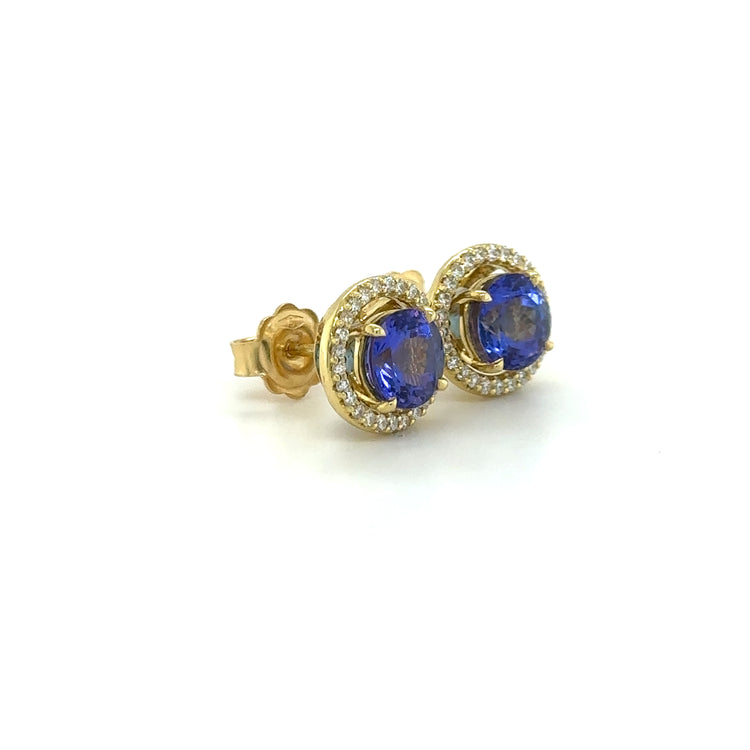 Tanzanite and Diamond Halo Stud Earrings, exquisite gemstone jewelry, elegant stud earrings, vibrant tanzanite stones, brilliant diamonds, sophisticated halo design, luxurious accessories, timeless elegance, fine craftsmanship, statement jewelry, radiant sparkle.