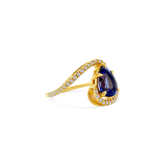 A sparkling, pear-shaped tanzanite, set in gleaming, white gold, surrounded by shimmering, round-cut diamonds, creating a stunning, elegant ring, perfect for any special occasion.