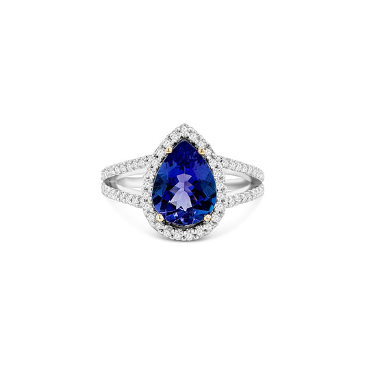 "A stunning pear shape tanzanite ring, featuring a dazzling diamond halo, perfect for special occasions or everyday elegance, exquisite gemstone jewelry, pear cut tanzanite with diamond accents, sparkling halo engagement ring, luxurious gemstone ring, fine jewelry with dazzling gemstones, elegant pear tanzanite ring with diamond halo, captivating pear shaped tanzanite surrounded by shimmering diamonds, exquisite pear cut tanzanite ring with brilliant diamond halo."
